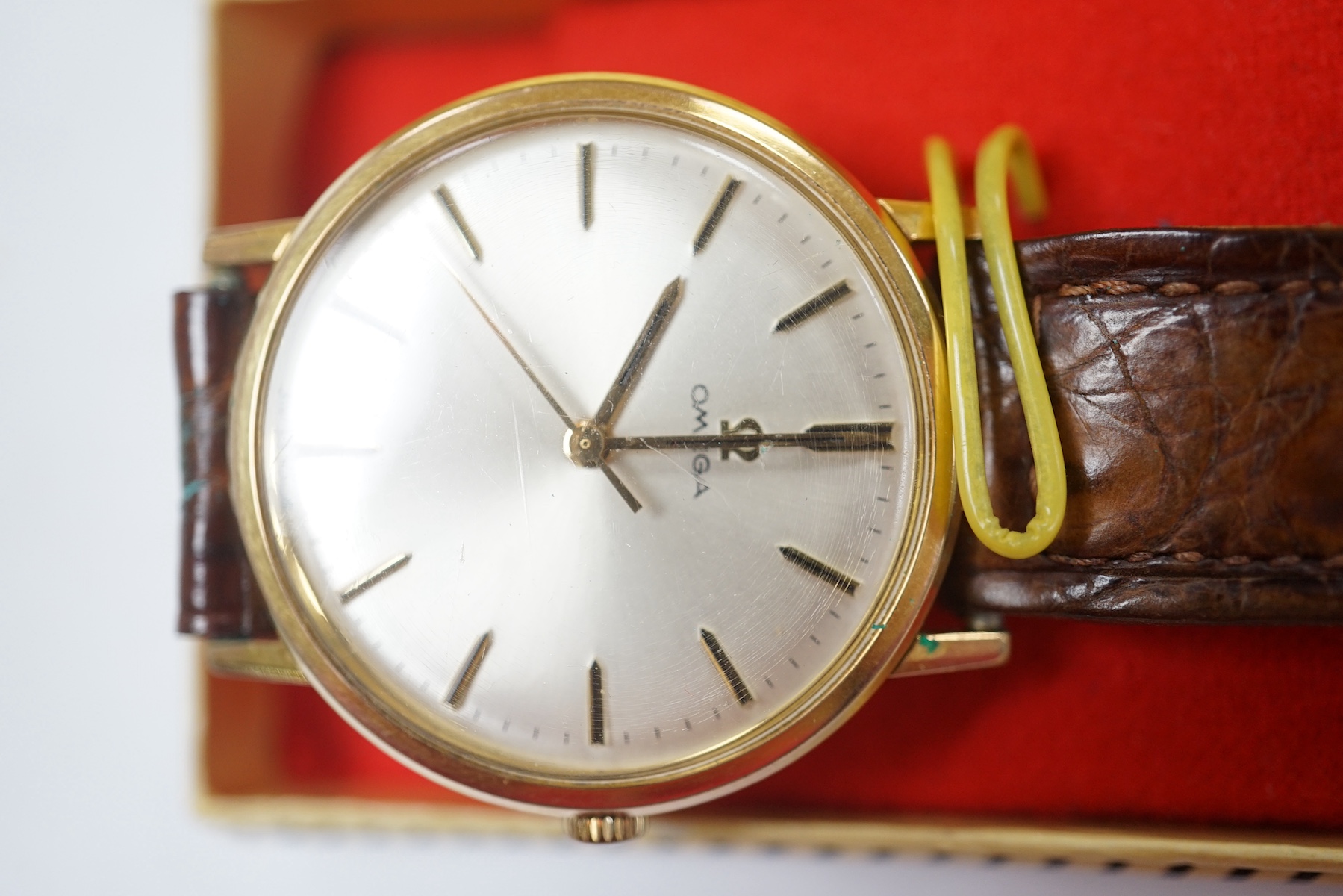 A gentleman's gold plated Omega manual wind wrist watch, on a leather strap, case diameter 34mm. Condition - Fair